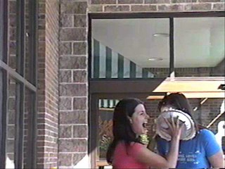 Two girls pie each other