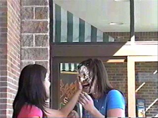Two girls pie each other