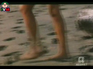 Anna Falchi wading into sea