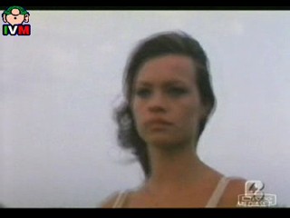 Anna Falchi wading into sea