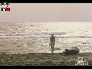 Anna Falchi wading into sea