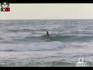 Anna Falchi wading into sea