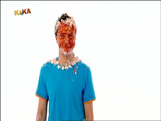 Male presenter caked