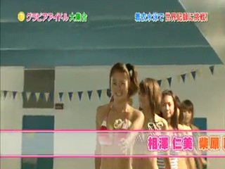 Japanese girl clothed swimmming.