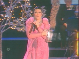 Singer Pours Water On Herself