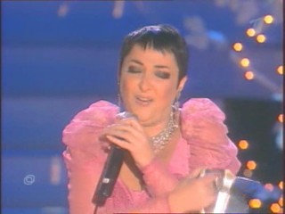 Singer Pours Water On Herself