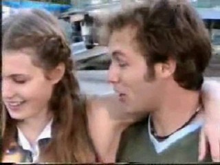 girl jumps from boat in jeans