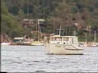 girl jumps from boat in jeans