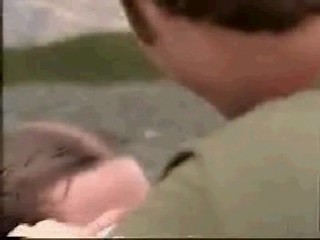 girl jumps from boat in jeans