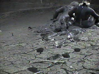 Rubber wetsuits in mud