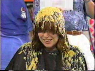 Women gets Cream Corn Poured over her head