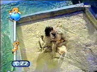 Mud wrestling (2 girls against 1 guy)