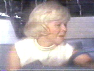 woman goes through car wash