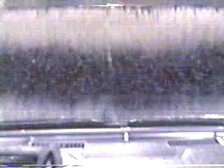 woman goes through car wash