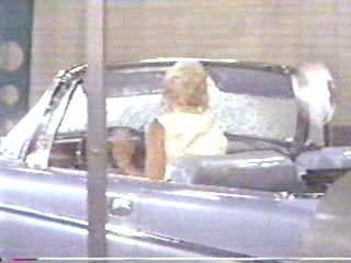 woman goes through car wash