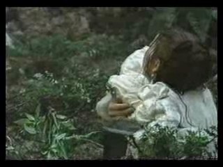 girl in wedding dress in bog