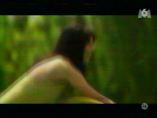 Two girls playing with a waterhose.