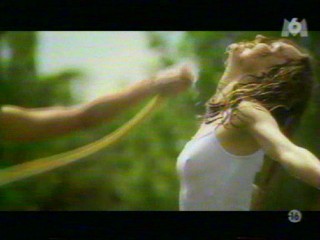 Two girls playing with a waterhose.