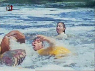 Early 80's  movie with sinking canoe